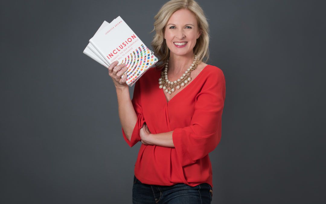Jennifer Brown holding her book, Inclusion